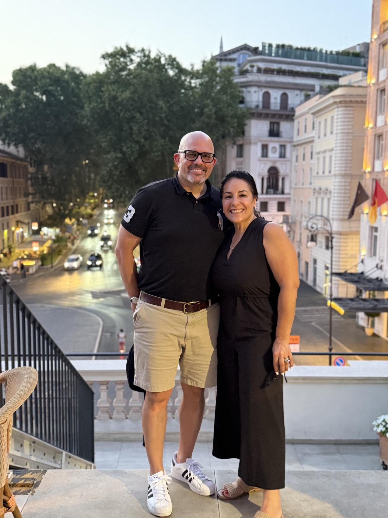Elena and Eric on a Roman terrace at dusk